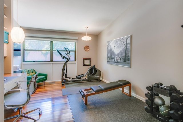 5848 Colhurst St, Dallas, TX 75230 - workout area with wood finished floors and baseboards