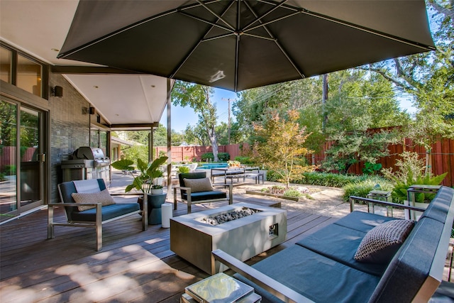 5848 Colhurst St, Dallas, TX 75230 - view of patio / terrace featuring an outdoor fire pit, a wooden deck, and a fenced backyard