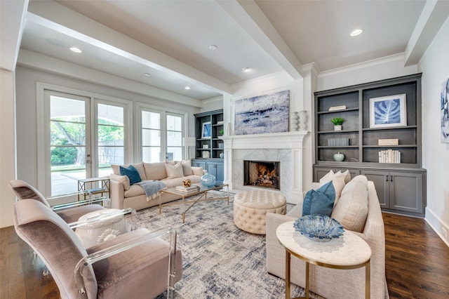 living area with crown molding, dark wood-style floors, a fireplace, french doors, and recessed lighting
