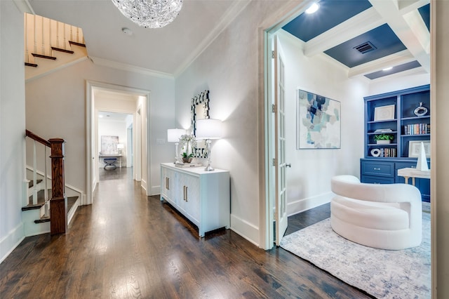 hall with stairway, dark wood-type flooring, crown molding, beam ceiling, and a chandelier