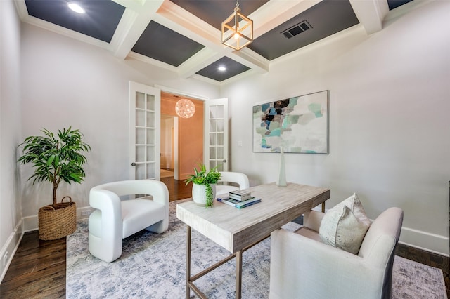office space featuring dark wood finished floors, baseboards, coffered ceiling, a chandelier, and beamed ceiling
