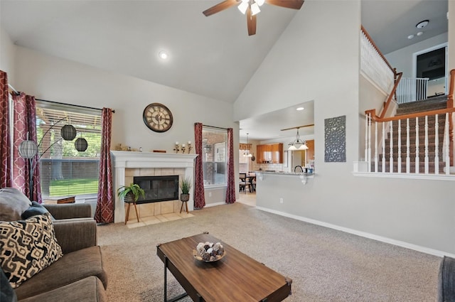 4624 Southpointe Dr, Richardson, TX 75082 - living area with a ceiling fan, carpet, baseboards, a fireplace, and high vaulted ceiling