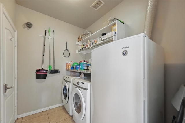 4624 Southpointe Dr, Richardson, TX 75082 - clothes washing area with separate washer and dryer, light tile patterned floors, and baseboards