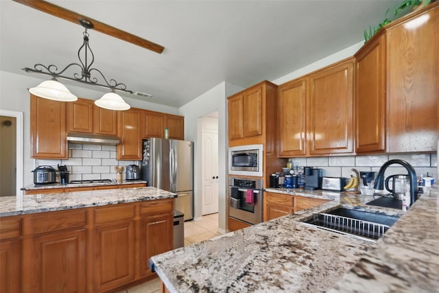 4624 Southpointe Dr, Richardson, TX 75082 - kitchen with appliances with stainless steel finishes, a sink, tasteful backsplash, light stone counters, and light tile patterned floors