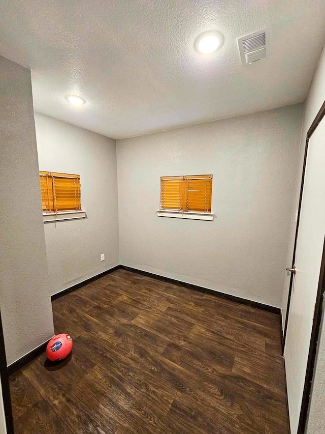 325 Fcr 1211, Fairfield, TX 75840 - unfurnished room with wood finished floors, a textured ceiling, and baseboards
