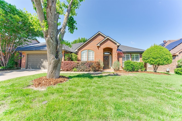 2505 Hillary Trl, Mansfield, TX 76063 - view of front of home featuring brick siding, driveway, a front lawn, and a garage