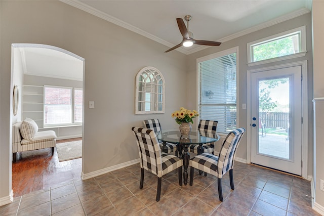 2505 Hillary Trl, Mansfield, TX 76063 - dining room featuring ornamental molding, healthy amount of natural light, tile patterned floors, a ceiling fan, and baseboards