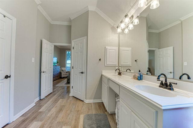 2505 Hillary Trl, Mansfield, TX 76063 - ensuite bathroom with wood finished floors, ornamental molding, double vanity, baseboards, and vaulted ceiling