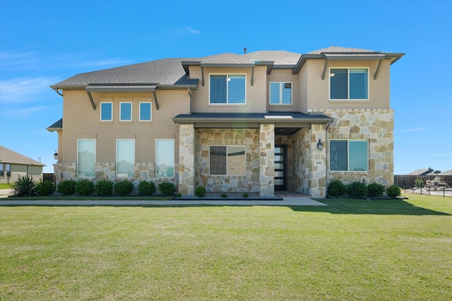 1006 Bent Tree Ln, Gunter, TX 75058 - view of front of home featuring stone siding, stucco siding, a front yard, and a shingled roof
