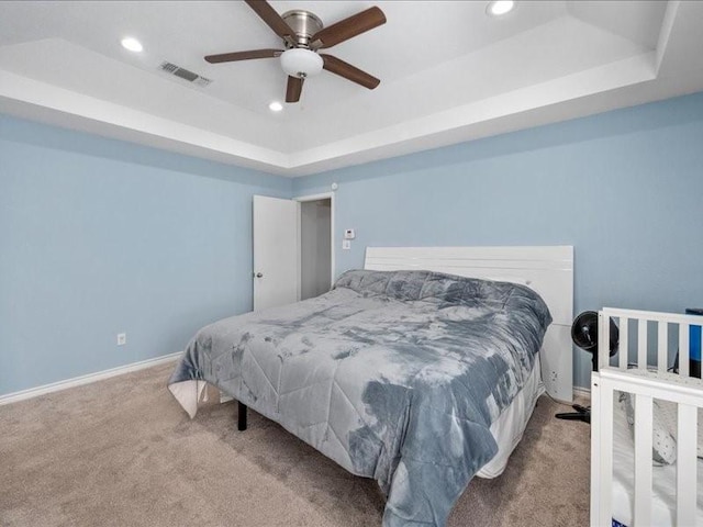 1008 Breezewood Dr, Arlington, TX 76017 - carpeted bedroom with a raised ceiling, recessed lighting, baseboards, and ceiling fan