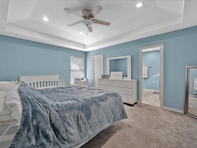 1008 Breezewood Dr, Arlington, TX 76017 - bedroom with a raised ceiling, light carpet, recessed lighting, baseboards, and ensuite bathroom