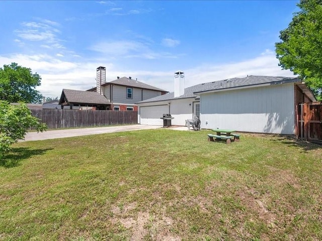 1008 Breezewood Dr, Arlington, TX 76017 - rear view of house with driveway and a garage