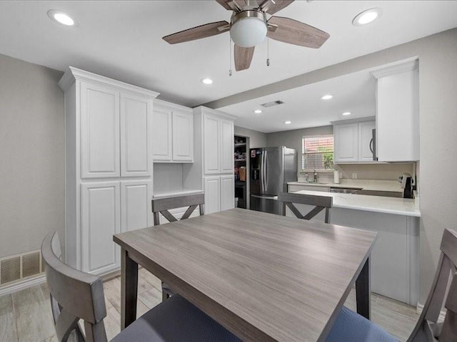 1008 Breezewood Dr, Arlington, TX 76017 - dining space featuring a ceiling fan, light wood-style floors, and recessed lighting