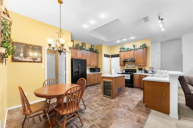 3953 Silver Springs Dr, Fort Worth, TX 76123 - kitchen with black appliances, a peninsula, a kitchen island, light countertops, and recessed lighting