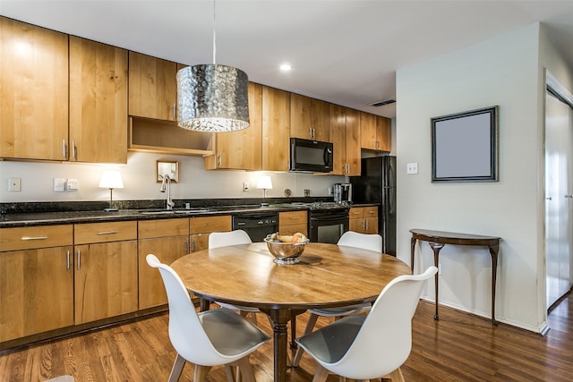 4616 W Lovers Ln Unit 231, Dallas, TX 75209 - kitchen featuring black appliances, a sink, dark wood finished floors, brown cabinetry, and recessed lighting