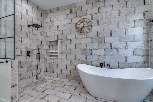 full bathroom with a tile shower and a soaking tub