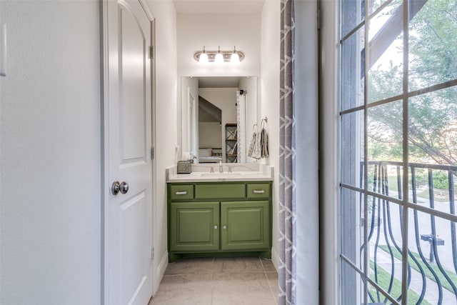 bathroom featuring tile patterned flooring, plenty of natural light, and vanity