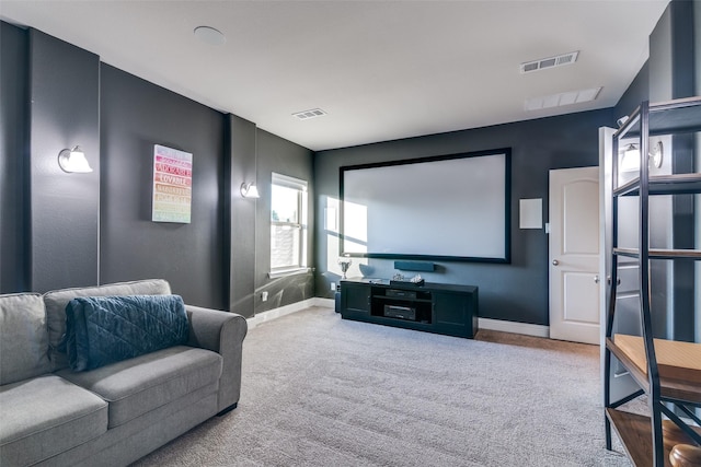 carpeted cinema room with baseboards