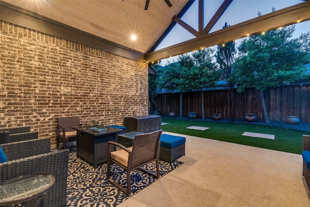 view of patio / terrace with fence and a ceiling fan