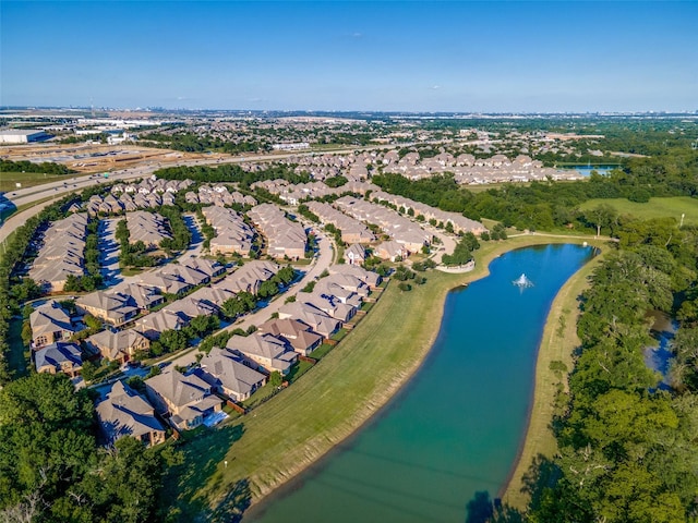 view of property location featuring a large body of water and nearby suburban area