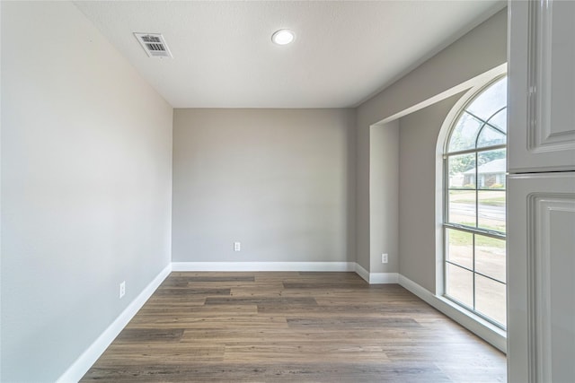 3809 Glengate Dr, Arlington, TX 76016 - unfurnished room with baseboards, wood finished floors, and recessed lighting