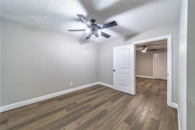 3809 Glengate Dr, Arlington, TX 76016 - unfurnished room with ceiling fan, dark wood-style flooring, baseboards, and a textured ceiling