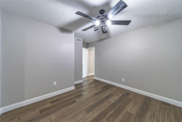 3809 Glengate Dr, Arlington, TX 76016 - empty room featuring baseboards, a ceiling fan, dark wood-style flooring, and a textured ceiling