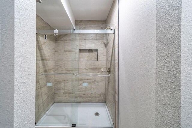 3809 Glengate Dr, Arlington, TX 76016 - full bath with a textured wall and a shower stall