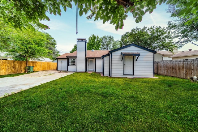 3809 Glengate Dr, Arlington, TX 76016 - back of property with a chimney, driveway, and a shingled roof