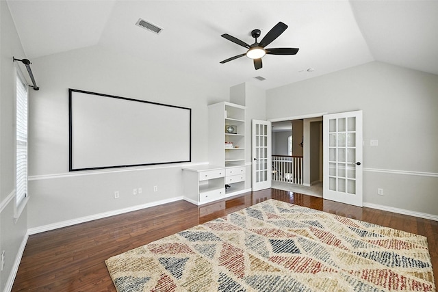 2726 Bandolier Ln, Frisco, TX 75033 - home theater room featuring french doors, vaulted ceiling, a ceiling fan, and wood finished floors