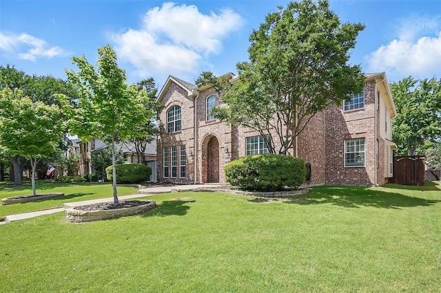 2726 Bandolier Ln, Frisco, TX 75033 - view of front facade with brick siding and a front yard