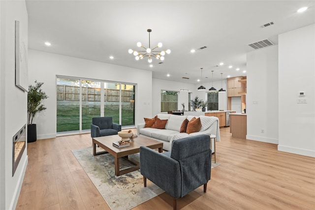 426 Avenue Ave E, Dallas, TX 75203 - living area with light wood-type flooring, a chandelier, recessed lighting, and baseboards