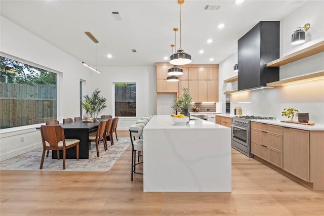 426 Avenue Ave E, Dallas, TX 75203 - kitchen featuring high end stainless steel range oven, open shelves, light brown cabinets, modern cabinets, and recessed lighting