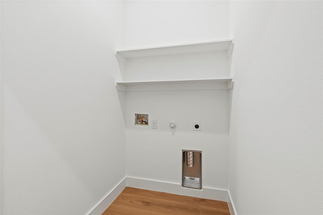 426 Avenue Ave E, Dallas, TX 75203 - laundry area featuring hookup for a washing machine, hookup for an electric dryer, gas dryer hookup, light wood-style floors, and baseboards