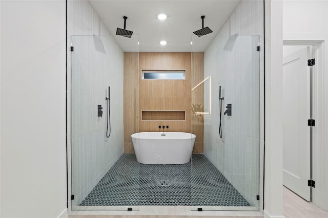 426 Avenue Ave E, Dallas, TX 75203 - bathroom featuring a shower stall and a freestanding tub