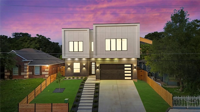 426 Avenue Ave E, Dallas, TX 75203 - contemporary home with concrete driveway, a garage, and board and batten siding