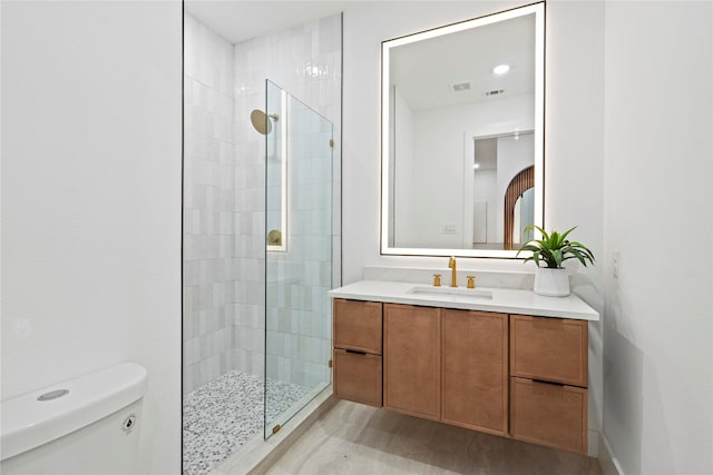 426 Avenue Ave E, Dallas, TX 75203 - bathroom featuring toilet, a stall shower, and vanity