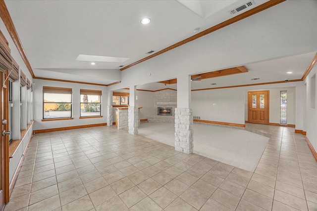 4029 Whiterock Trl, Garland, TX 75043 - unfurnished living room with lofted ceiling, a brick fireplace, light tile patterned floors, plenty of natural light, and crown molding
