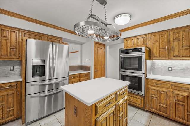 4029 Whiterock Trl, Garland, TX 75043 - kitchen featuring stainless steel appliances, brown cabinetry, tasteful backsplash, light tile patterned flooring, and light countertops