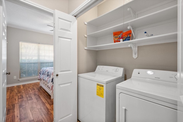 2101 Saint Michaels Dr Unit 109, Arlington, TX 76011 - washroom featuring washer and clothes dryer, dark wood finished floors, crown molding, and baseboards