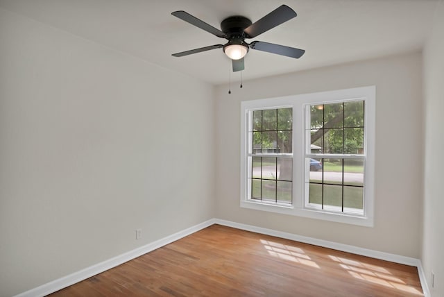 610 Phillips St, Cleburne, TX 76033 - spare room with baseboards, wood finished floors, and a ceiling fan