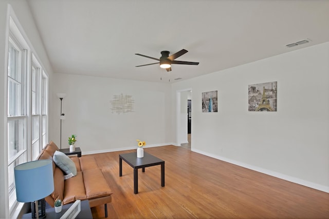 610 Phillips St, Cleburne, TX 76033 - living area with a ceiling fan, baseboards, and light wood-style flooring