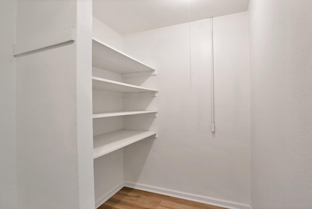 610 Phillips St, Cleburne, TX 76033 - walk in closet with wood finished floors
