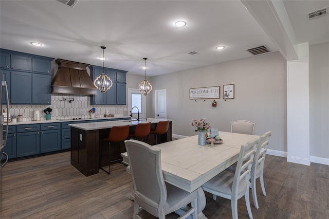 117 Rock Salt Dr, Springtown, TX 76082 - dining area featuring a chandelier, dark wood-style flooring, baseboards, and recessed lighting