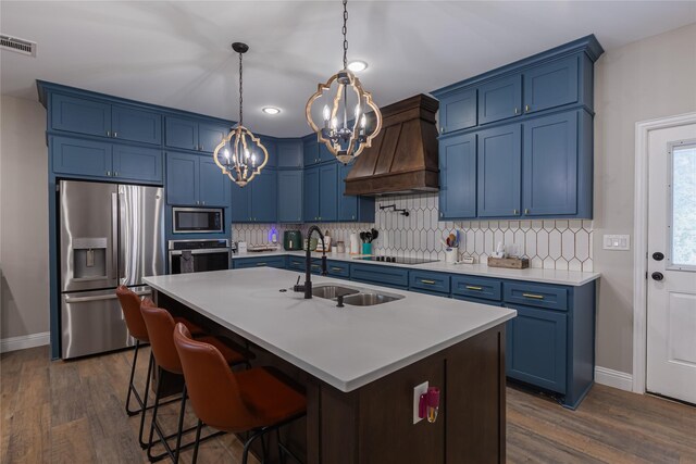 117 Rock Salt Dr, Springtown, TX 76082 - kitchen featuring blue cabinets, stainless steel appliances, and premium range hood