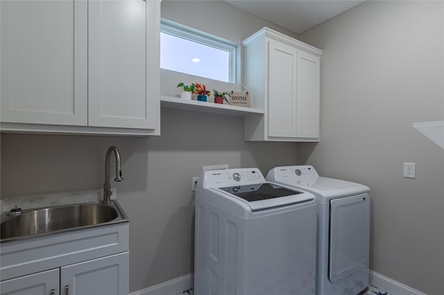 117 Rock Salt Dr, Springtown, TX 76082 - laundry room featuring washer and clothes dryer, baseboards, and cabinet space