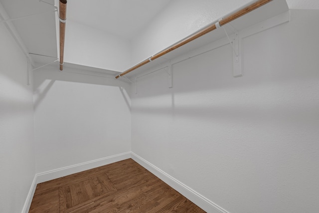 3329 8th Ave, Fort Worth, TX 76110 - spacious closet featuring dark wood-type flooring