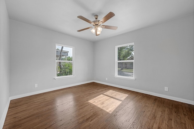 3329 8th Ave, Fort Worth, TX 76110 - unfurnished room featuring plenty of natural light, baseboards, and wood finished floors