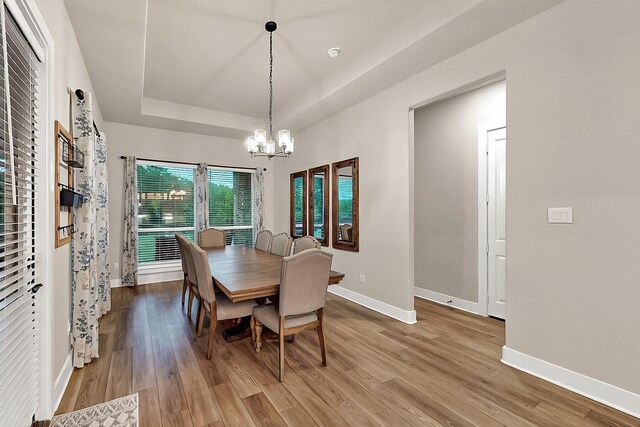 308 Secretariat, Hickory Creek, TX 75065 - dining area featuring baseboards, a chandelier, and wood finished floors