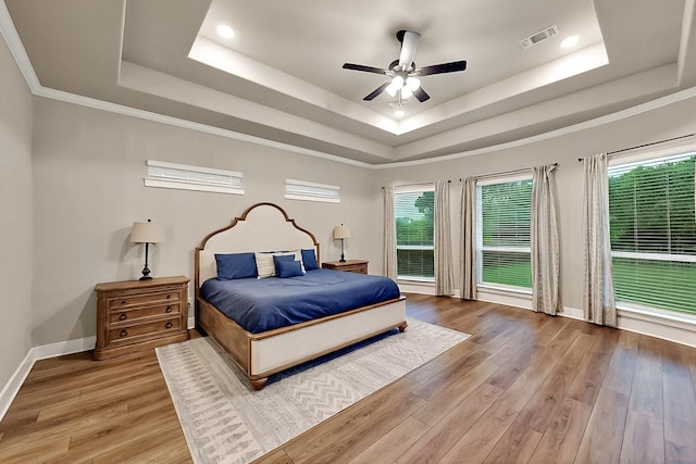308 Secretariat, Hickory Creek, TX 75065 - bedroom featuring a raised ceiling, wood finished floors, baseboards, ceiling fan, and recessed lighting